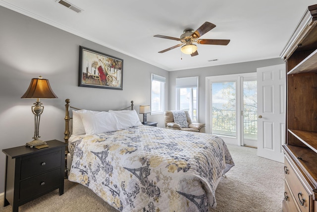 bedroom with ceiling fan, light carpet, visible vents, access to outside, and ornamental molding