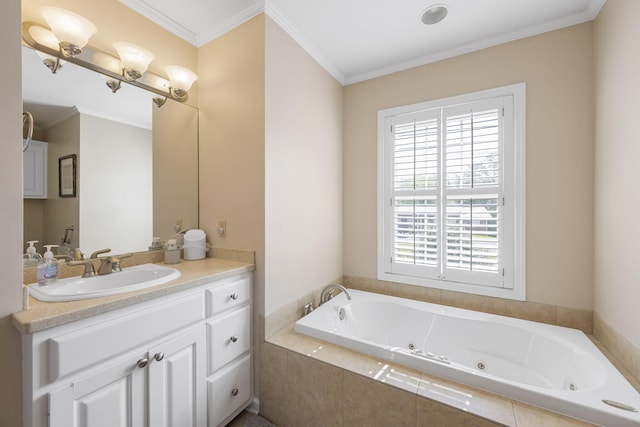 full bath featuring a jetted tub, vanity, and crown molding