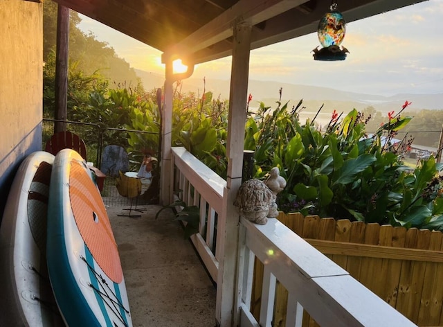 view of balcony at dusk