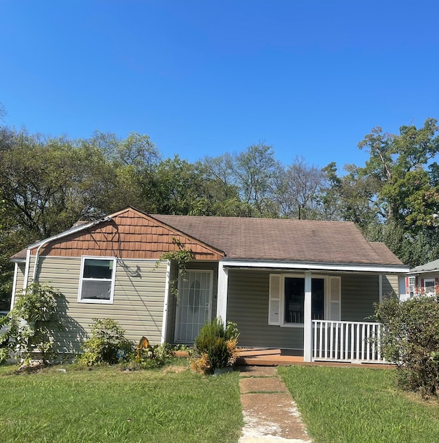 view of front of home featuring a porch and a front yard