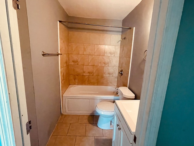 full bathroom featuring vanity, tiled shower / bath combo, toilet, and tile patterned flooring