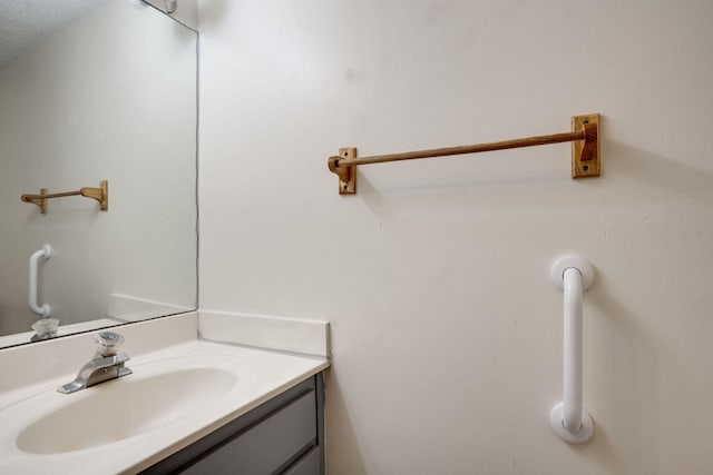 bathroom featuring vanity and a textured ceiling