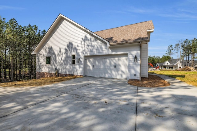 view of property exterior with a garage