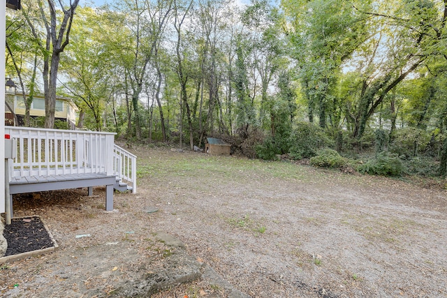 view of yard with a wooden deck