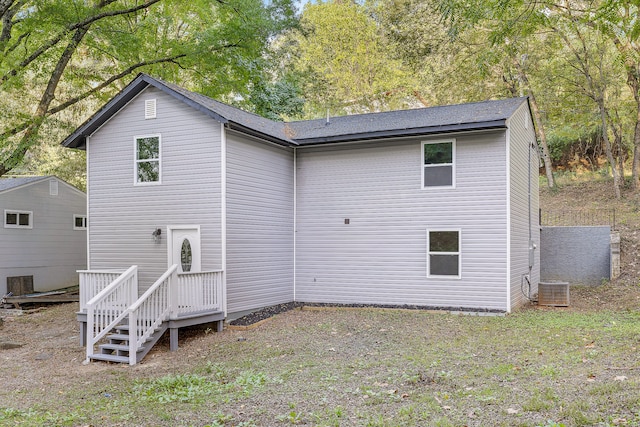 back of property with central AC