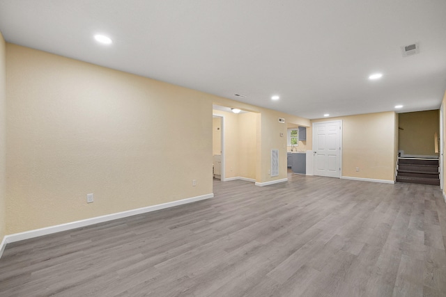 unfurnished living room featuring light wood-type flooring