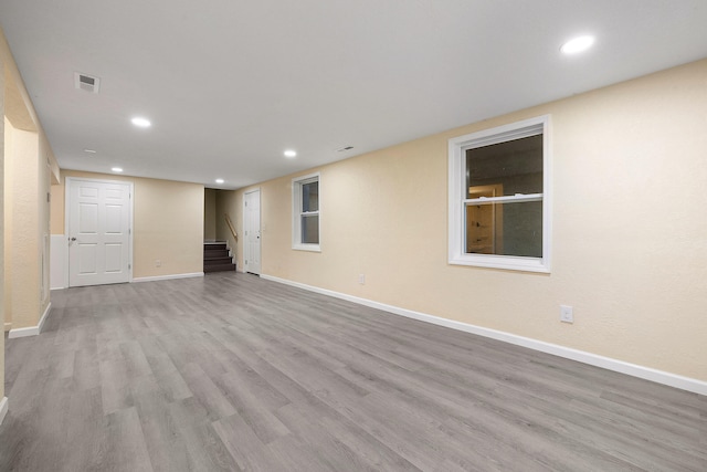 spare room featuring light hardwood / wood-style floors