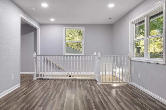 unfurnished room featuring dark hardwood / wood-style floors