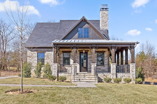 view of front facade with a porch and a front lawn