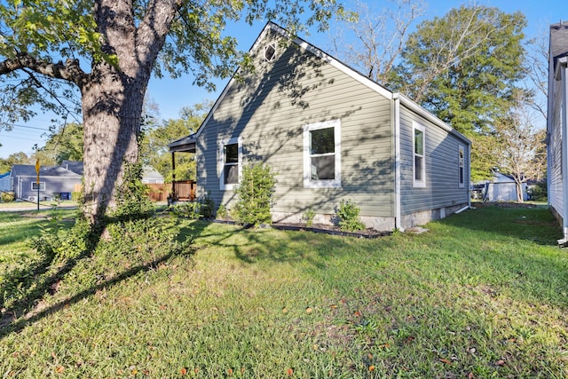 view of property exterior featuring a lawn