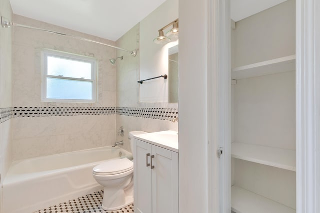 full bathroom with vanity, toilet, bathing tub / shower combination, and tile walls