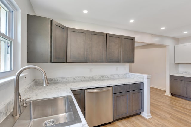kitchen featuring a sink, dishwasher, plenty of natural light, light wood-style flooring, and recessed lighting
