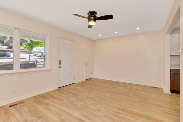 unfurnished living room featuring ceiling fan, light wood finished floors, recessed lighting, baseboards, and visible vents