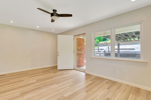 spare room featuring recessed lighting, baseboards, a ceiling fan, and light wood-type flooring