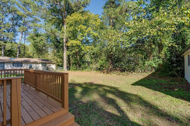 view of yard with a wooden deck