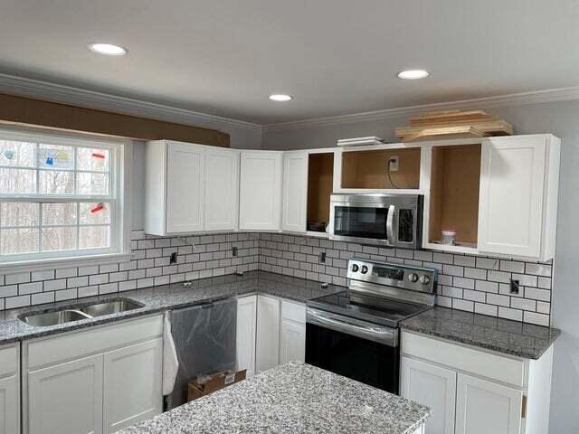 kitchen featuring white cabinetry and stainless steel appliances