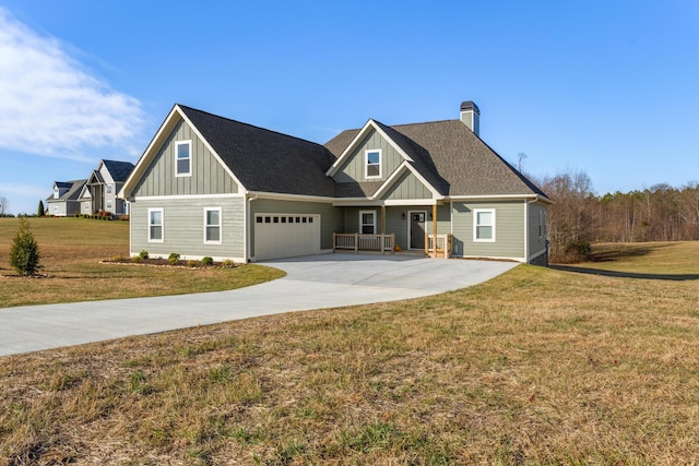 craftsman-style home featuring a front yard and a garage