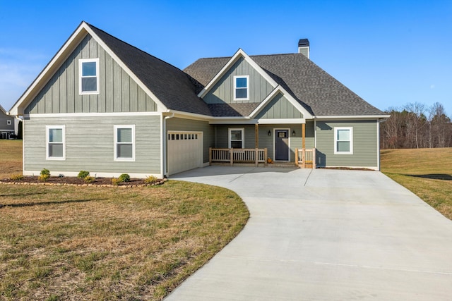 craftsman-style home featuring a porch, a front lawn, and a garage