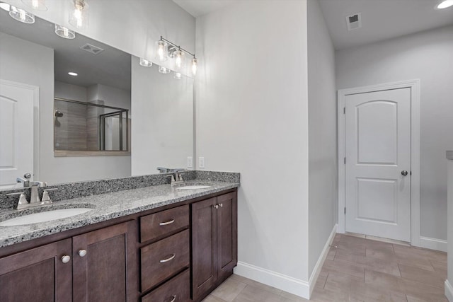 bathroom with vanity and an enclosed shower