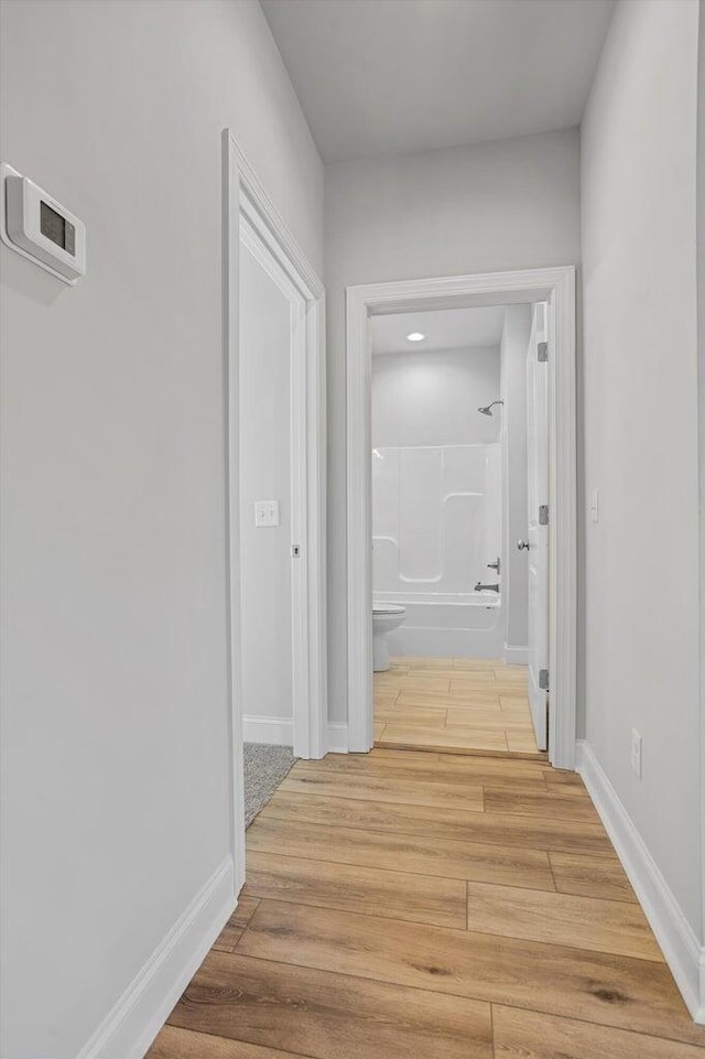 corridor featuring hardwood / wood-style flooring