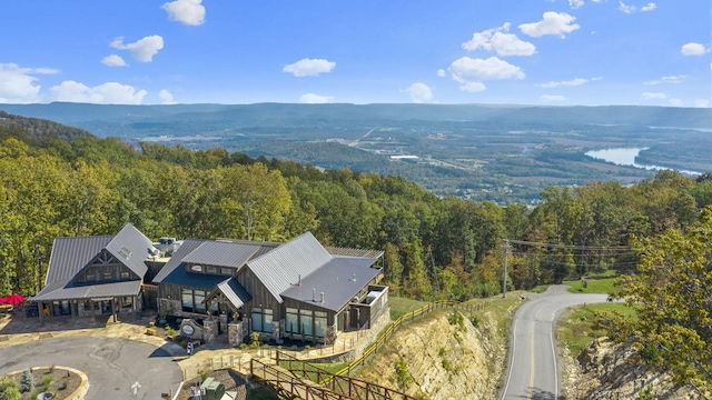 birds eye view of property with a mountain view