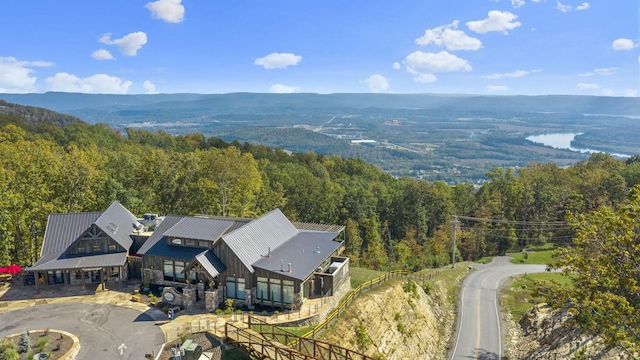 birds eye view of property with a forest view