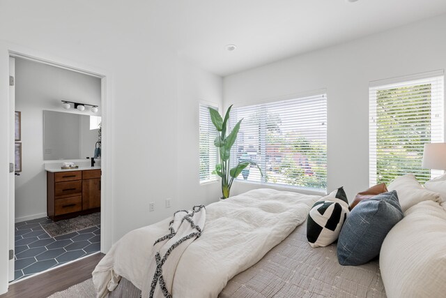 bedroom with dark hardwood / wood-style floors