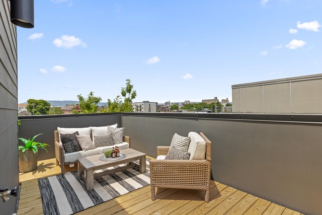 wooden terrace with outdoor lounge area