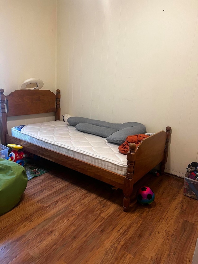 bedroom with hardwood / wood-style floors