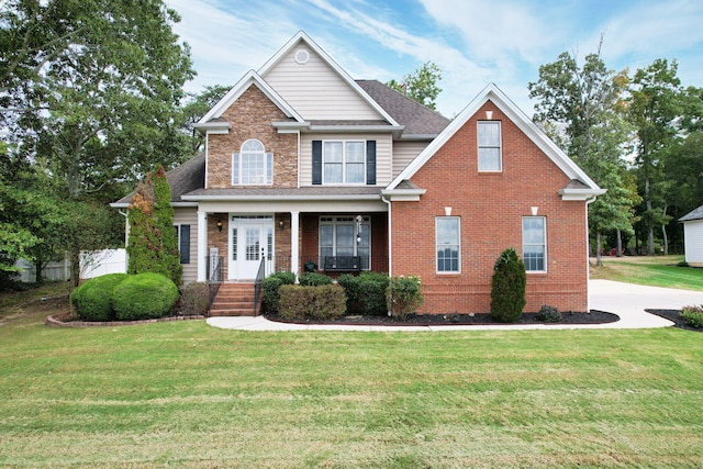 craftsman-style home with a front lawn