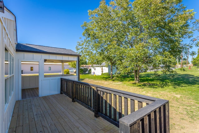 wooden terrace with a yard