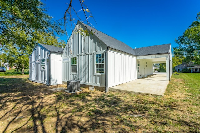 back of property featuring a yard and a patio area