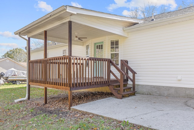 wooden deck featuring ceiling fan