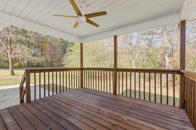 deck with a lawn and ceiling fan