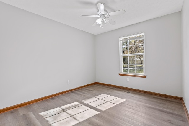 unfurnished room with ceiling fan and light hardwood / wood-style flooring