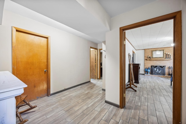 hall with light hardwood / wood-style flooring