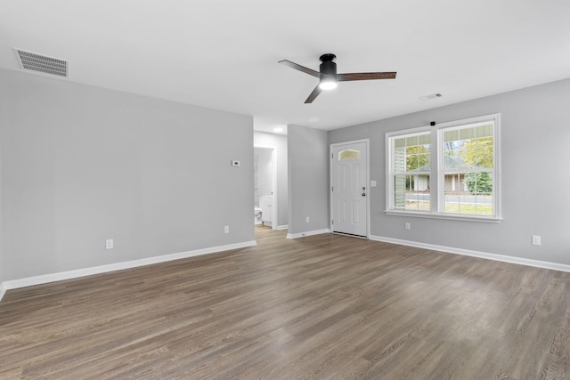 unfurnished living room with hardwood / wood-style flooring and ceiling fan