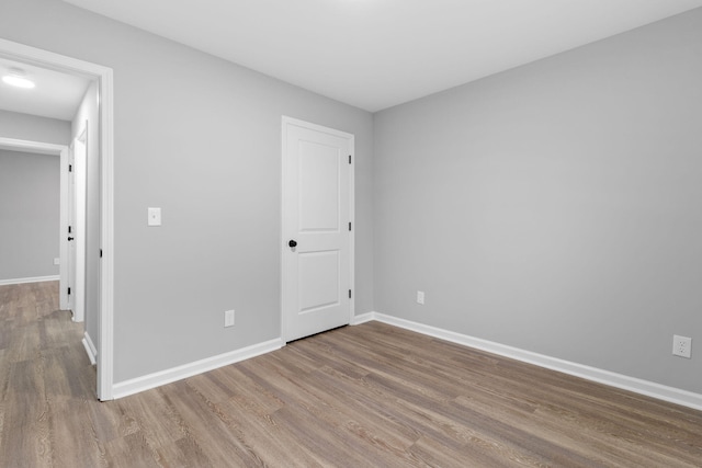 spare room featuring hardwood / wood-style flooring