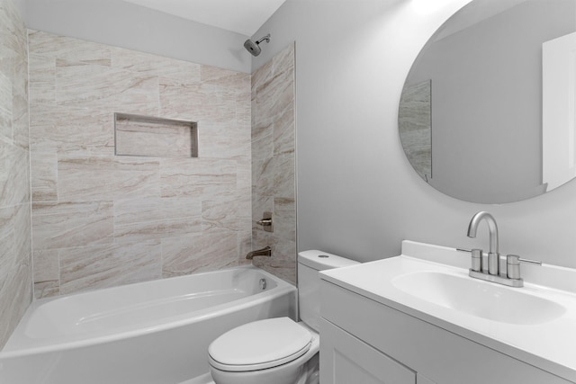 full bathroom featuring vanity, toilet, and tiled shower / bath