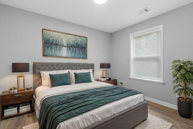 bedroom featuring wood-type flooring