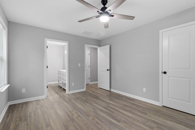 unfurnished bedroom featuring ceiling fan and wood-type flooring