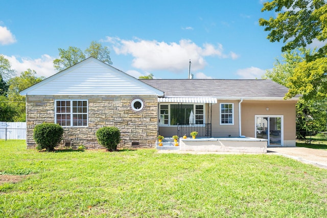 view of front of house featuring a front lawn and a patio area