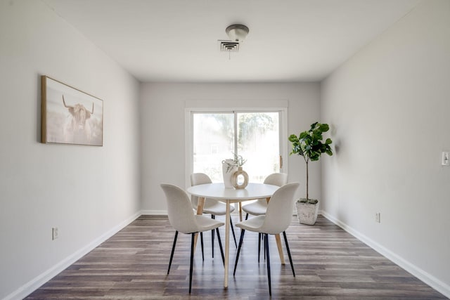 dining area featuring dark hardwood / wood-style flooring