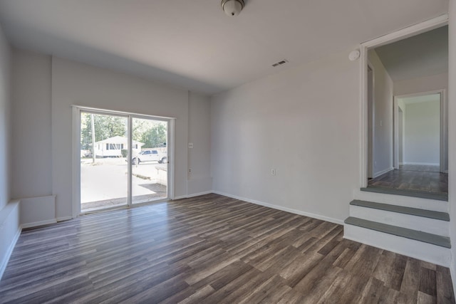 spare room with dark hardwood / wood-style flooring