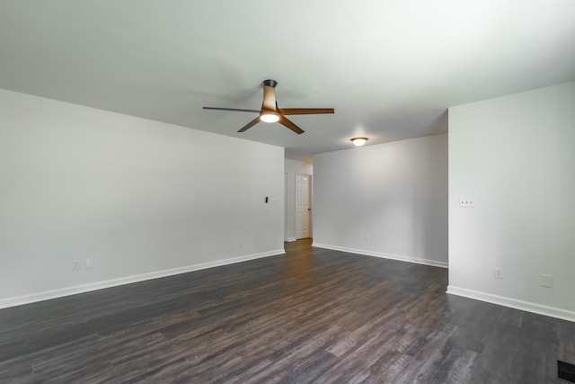 unfurnished room featuring dark wood-type flooring and ceiling fan