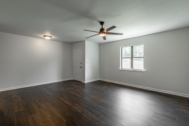 unfurnished room featuring dark hardwood / wood-style floors and ceiling fan