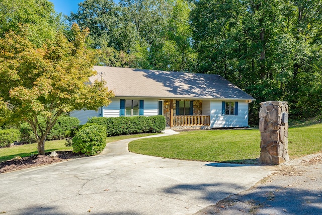 ranch-style house with a porch and a front yard