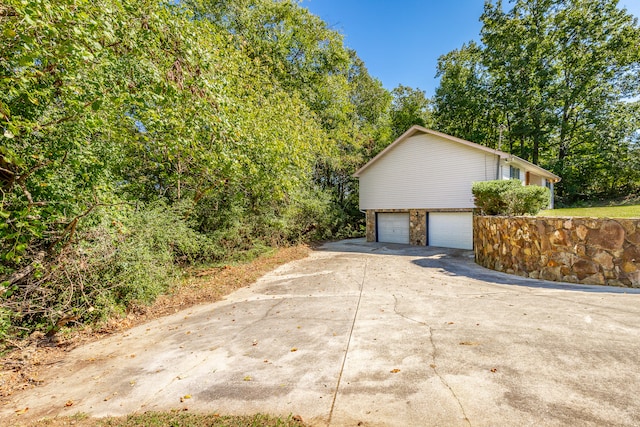 view of property exterior featuring a garage