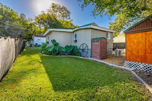 view of property exterior with a storage shed and a lawn