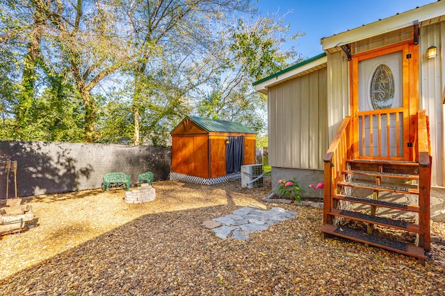 view of yard with a shed and cooling unit